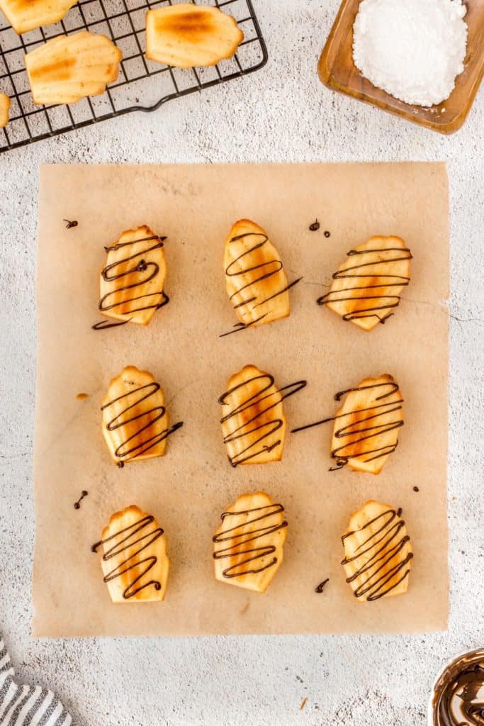Chocolate drizzled on madeleines