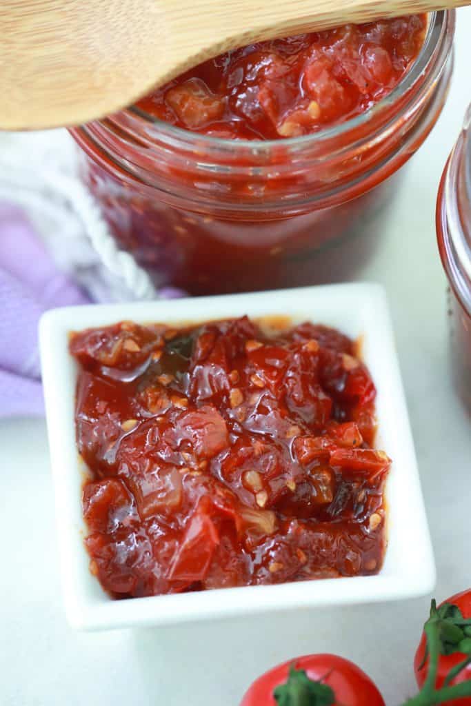 Tomato jam in a jar and in a dish