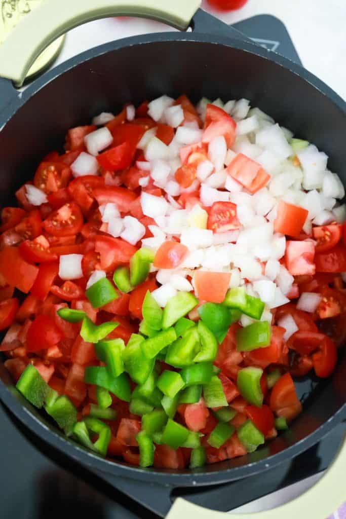 Vegetables for tomato jam in a pot