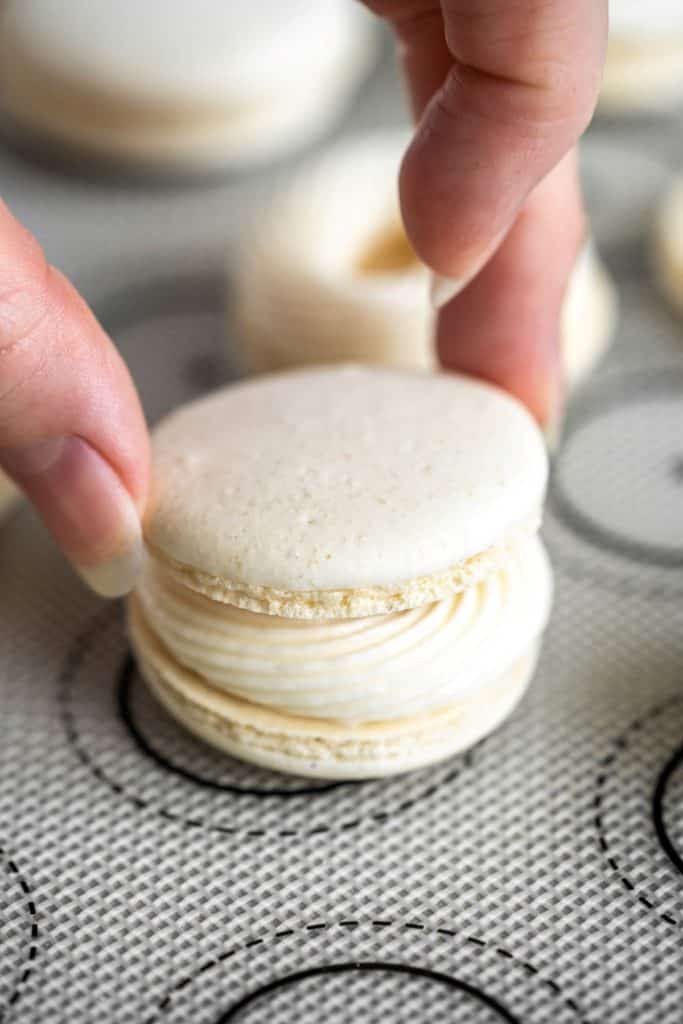 Placing the second macaron on top