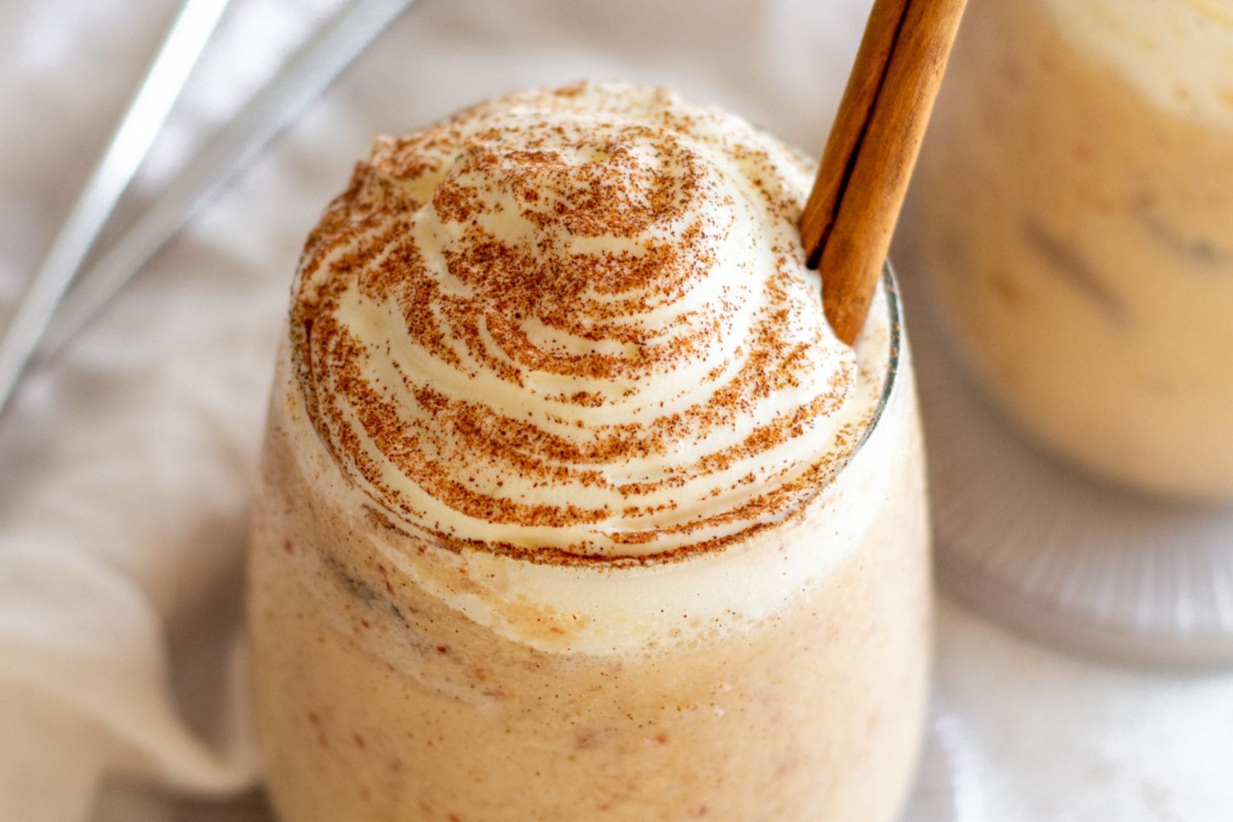 An Apple Pie Smoothie is a delicious way to start your day in the fall or any time. You can customize this breakfast drink to how you like it. Indulgent to very healthy, but either way, they are scrumptious. Close-up of top.