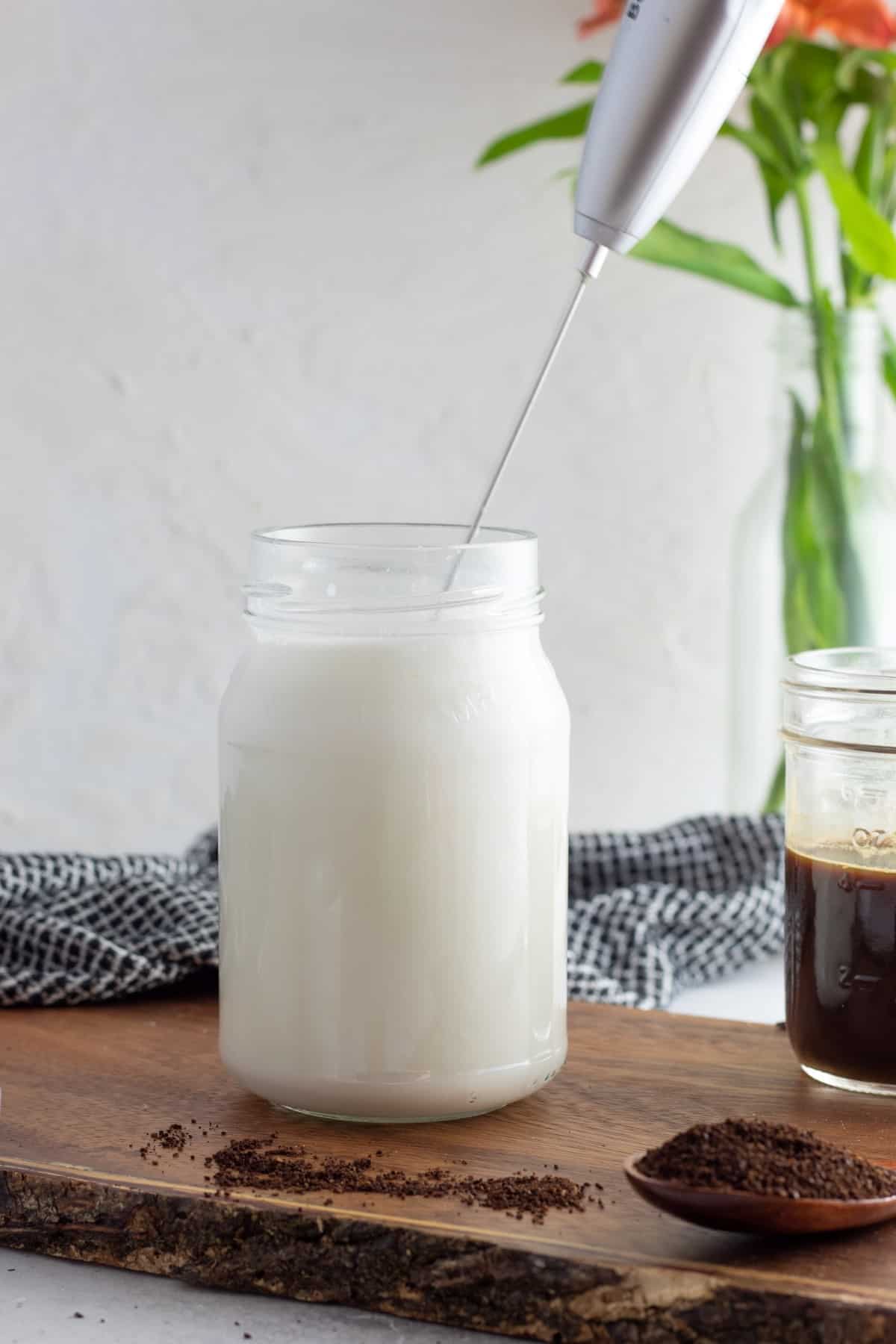 Frothing milk in a jar. 