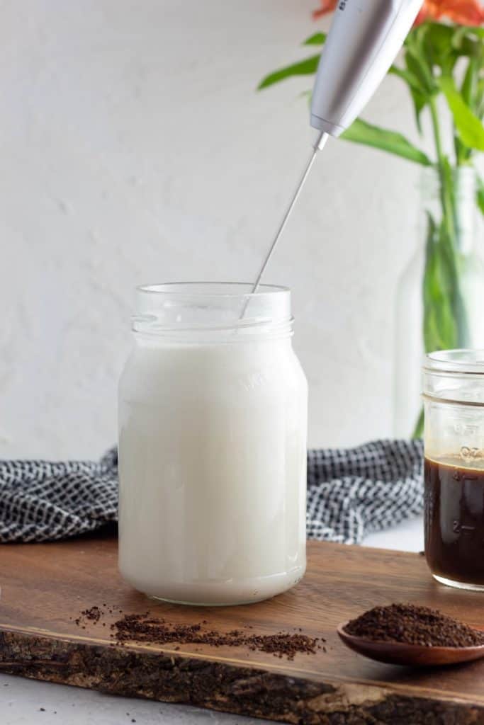 frothing milk in a jar