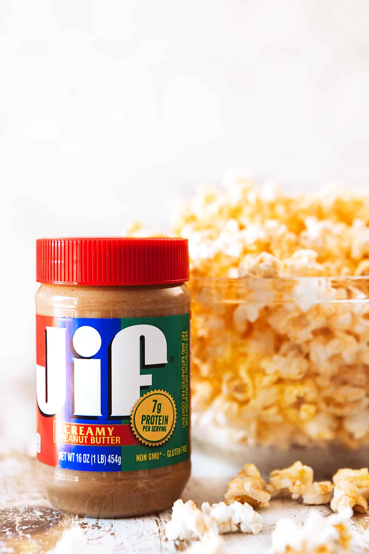 Jif Peanut Butter and a bowl of popped corn for a Peanut Butter Popcorn Recipe