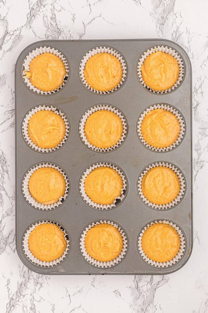 Filled baking pan with cupcakes ready for the oven