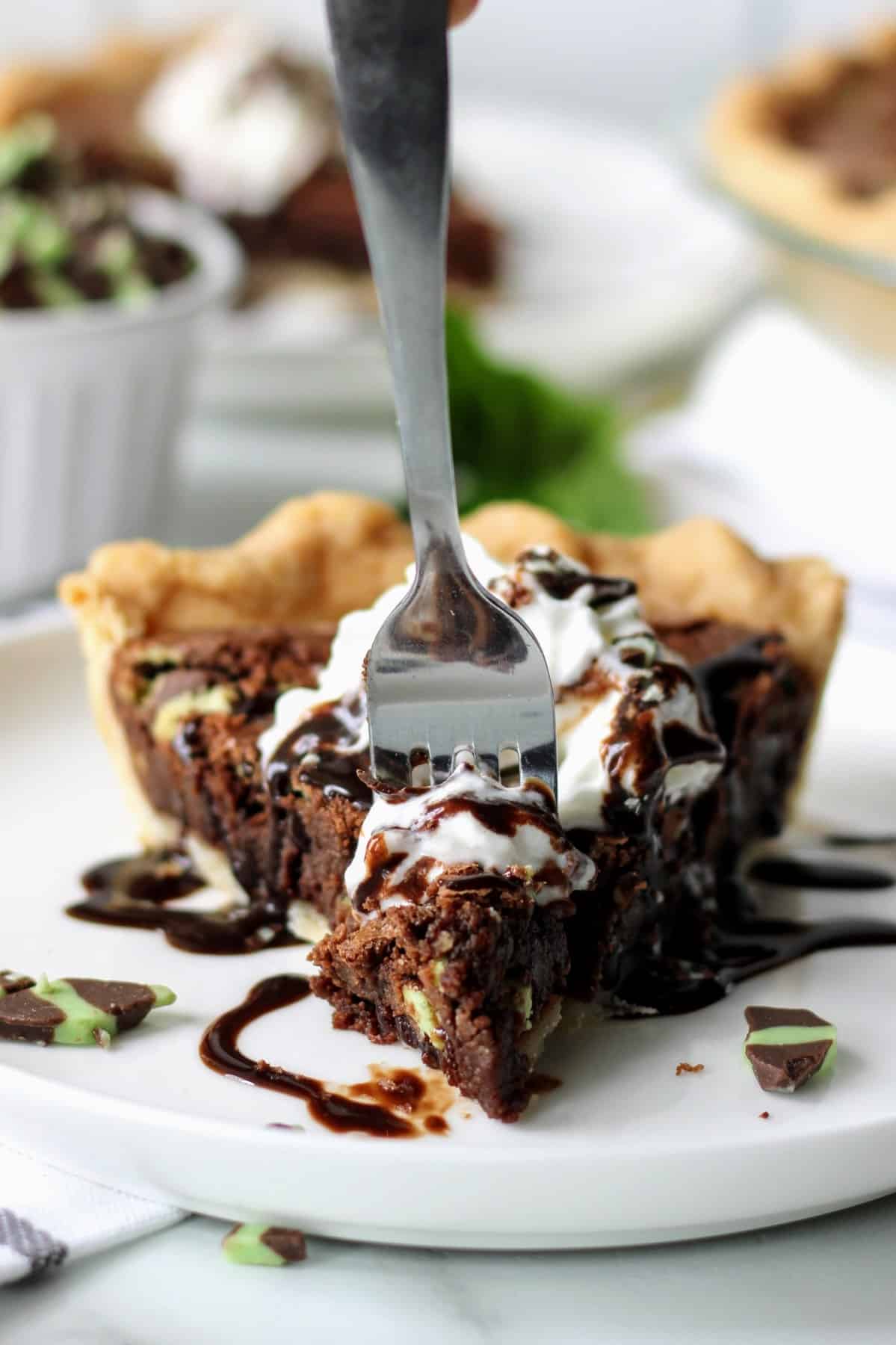 Putting a fork into a slice of pie. 