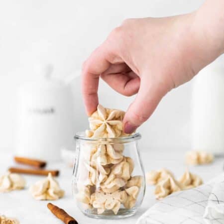 Cinnamon Meringue Cookies in a clear jar.