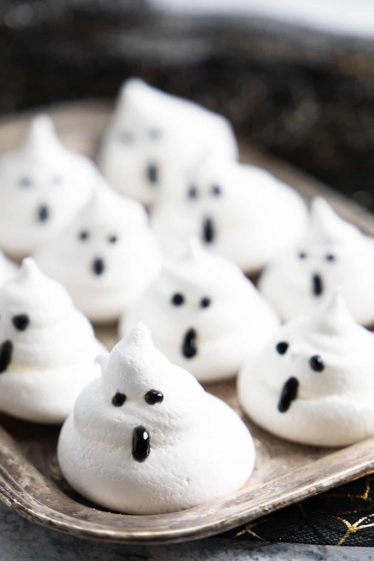 Ghost meringues on a silver tray