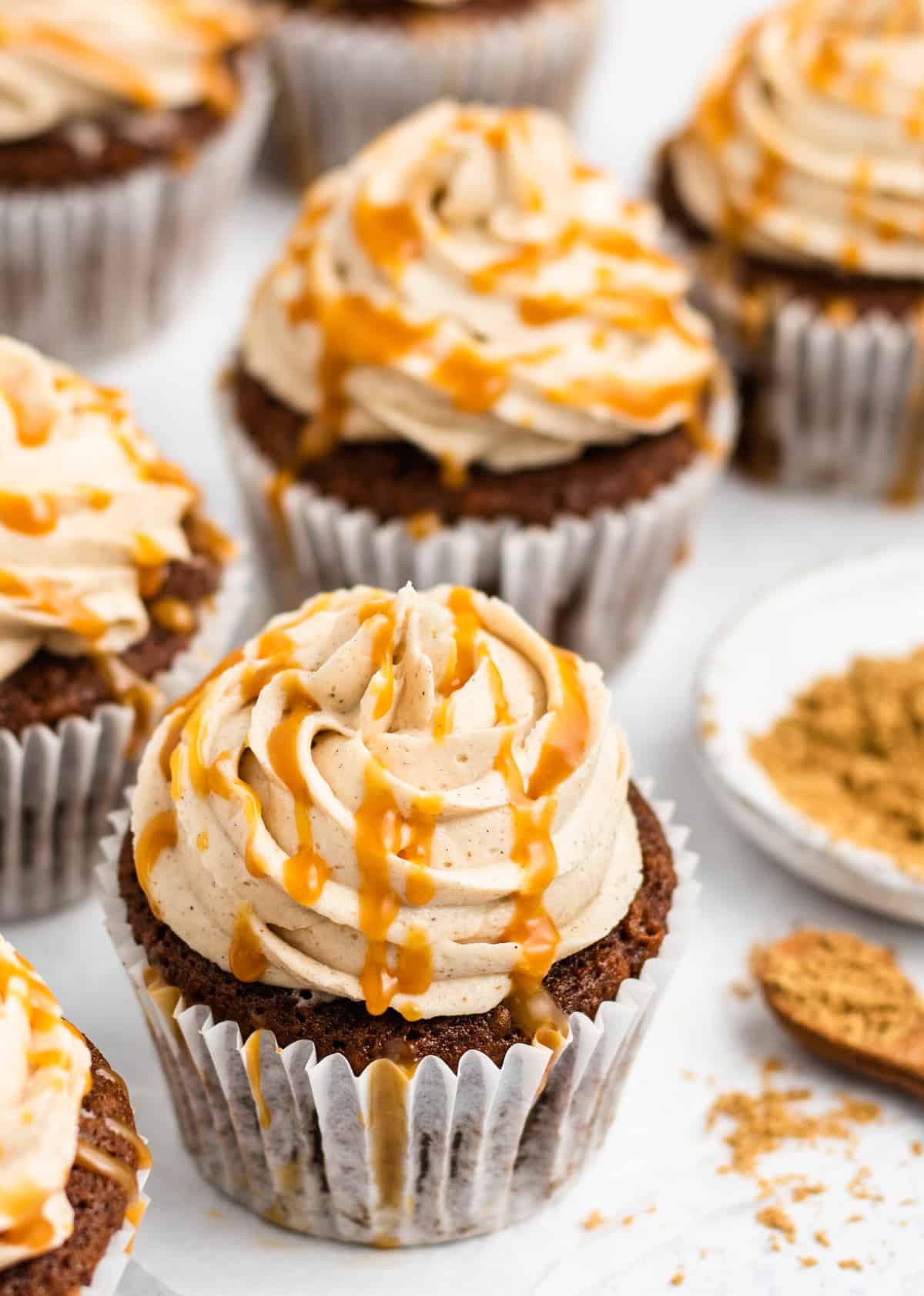 Festive Gingerbread Cupcakes drizzled with caramel sauce. 