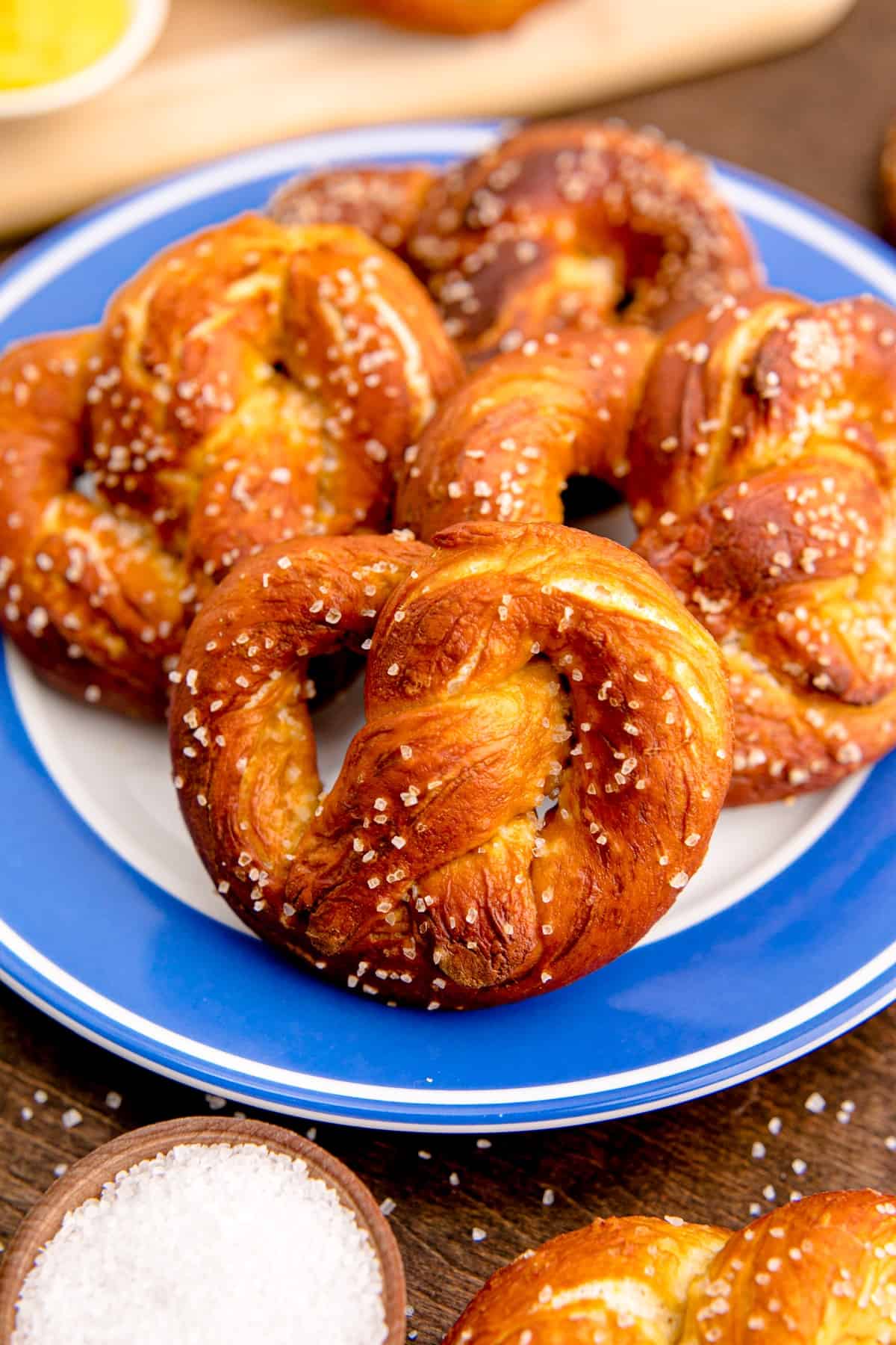 Soft pretzels on a blue and white plate