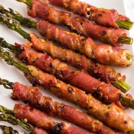 Bacon Wrapped Asparagus on a white background