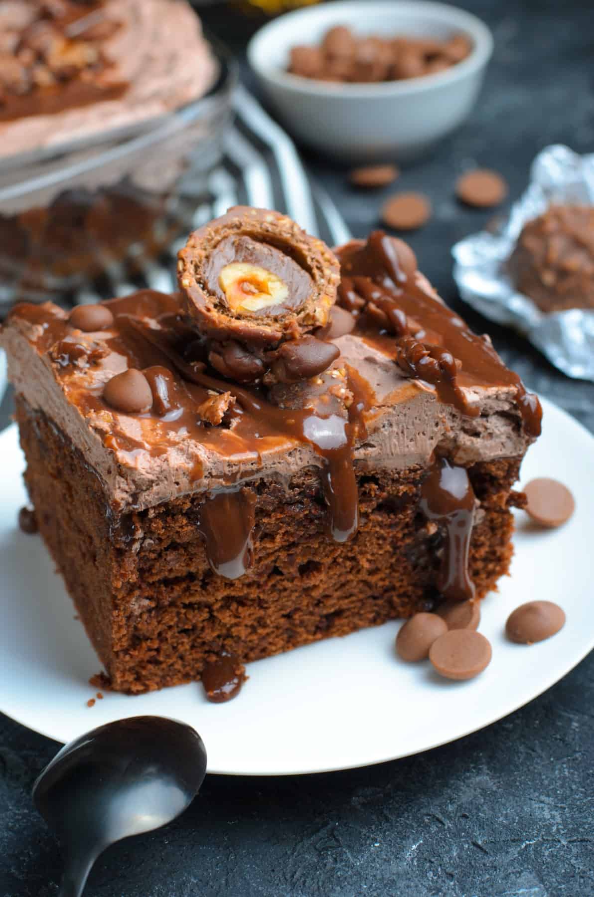 Close-up of Ferrero Rocher Chocolate Poke Cake on a plate. 