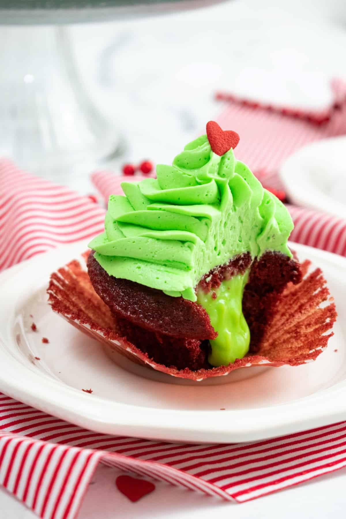 Showing the inside of a cupcake with its  ooey gooey green pudding center. 