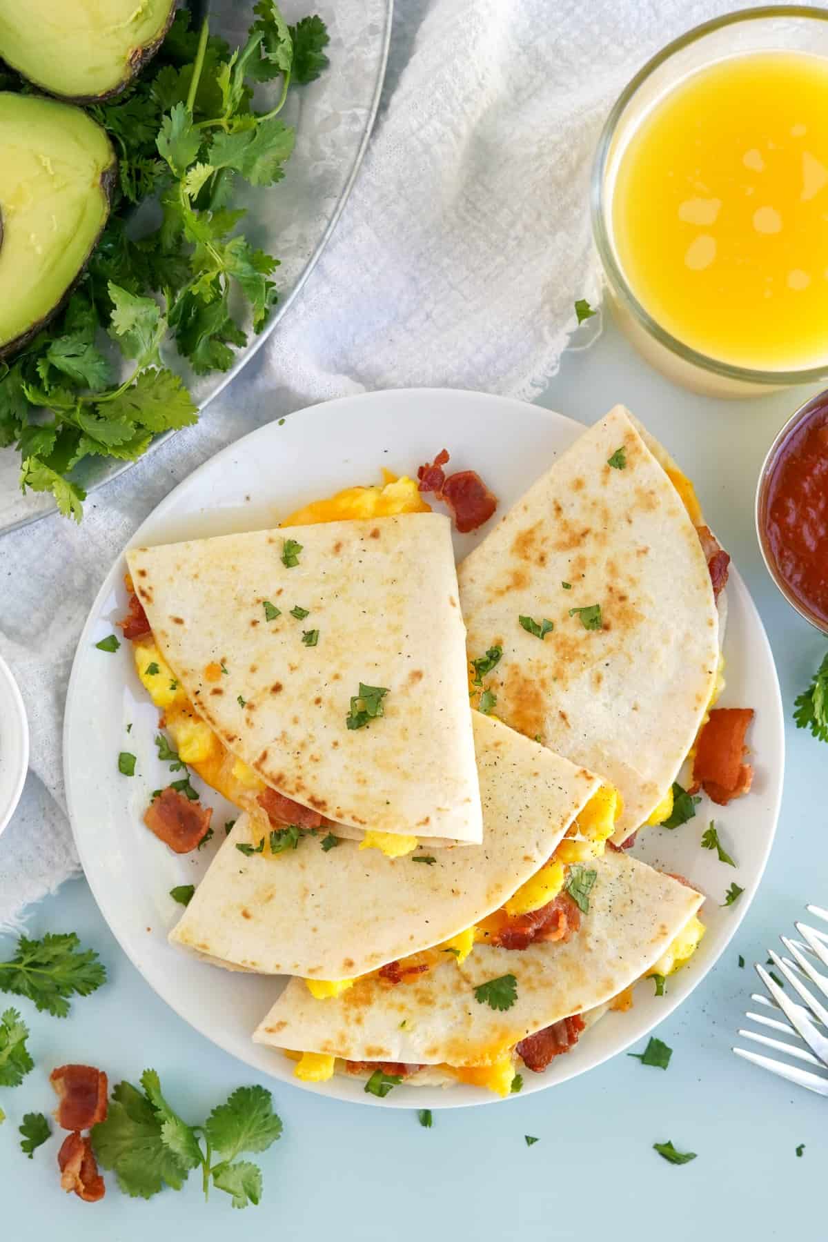 Overhead view of Easy Breakfast Quesadillas on a white plate. 