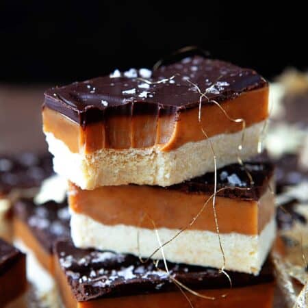 Stacked Millionaire Shortbread, top square has a bite taken