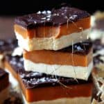 Stacked Millionaire Shortbread, top square has a bite taken