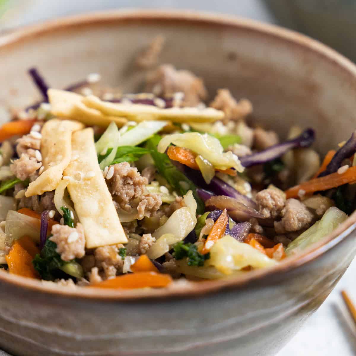 Square photo of egg roll in a bowl