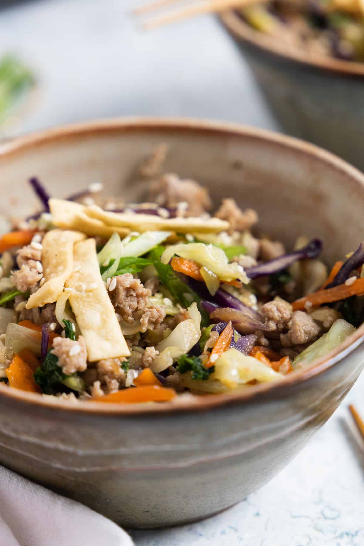 close up of egg roll in a bowl