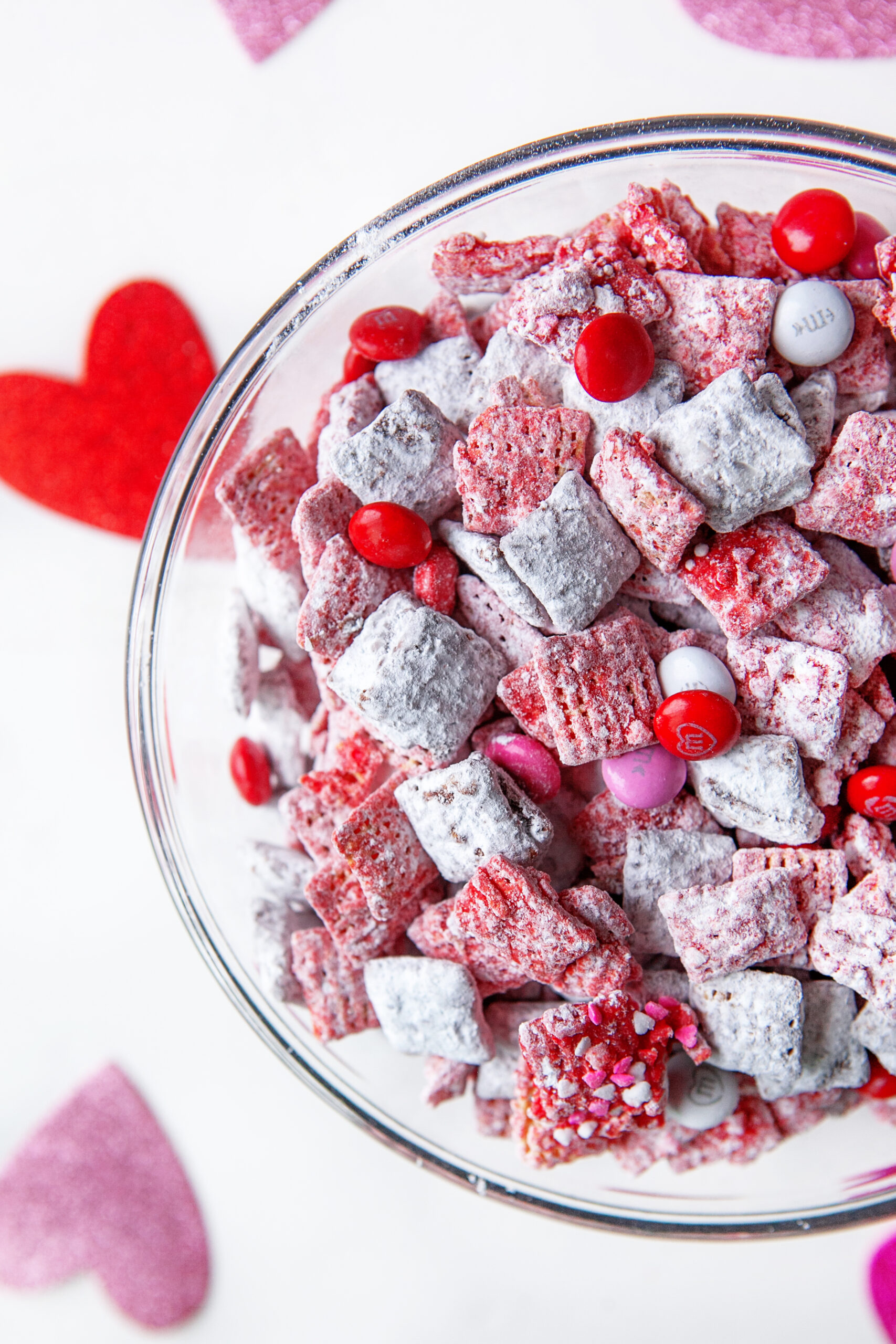 Valentine's Day Puppy Chow in a glass bowl. 