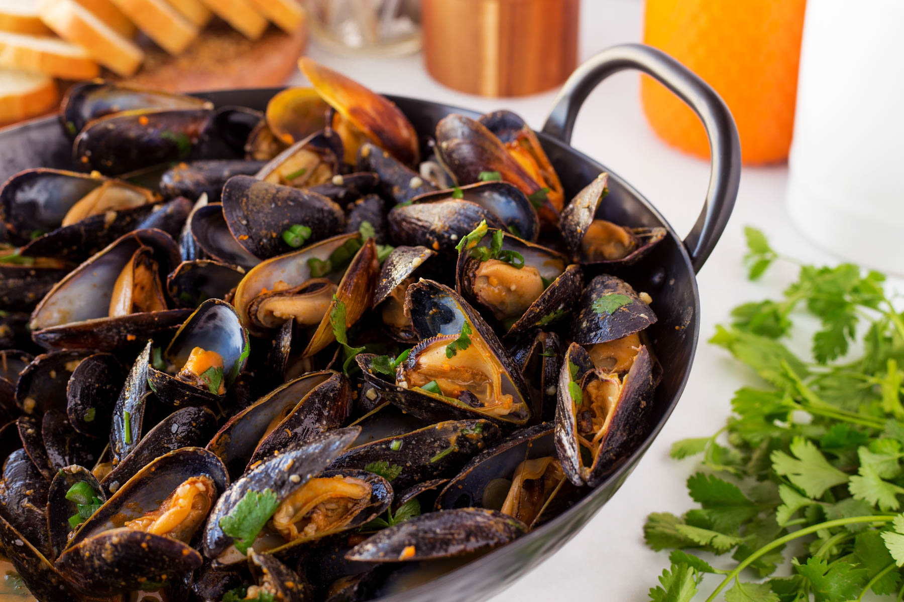 Horizontal of Thai mussels in a hammered pan. 