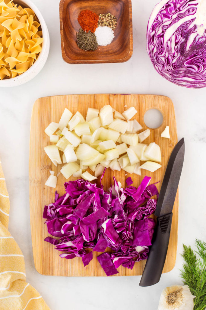 Chopped onion and red cabbage on a board