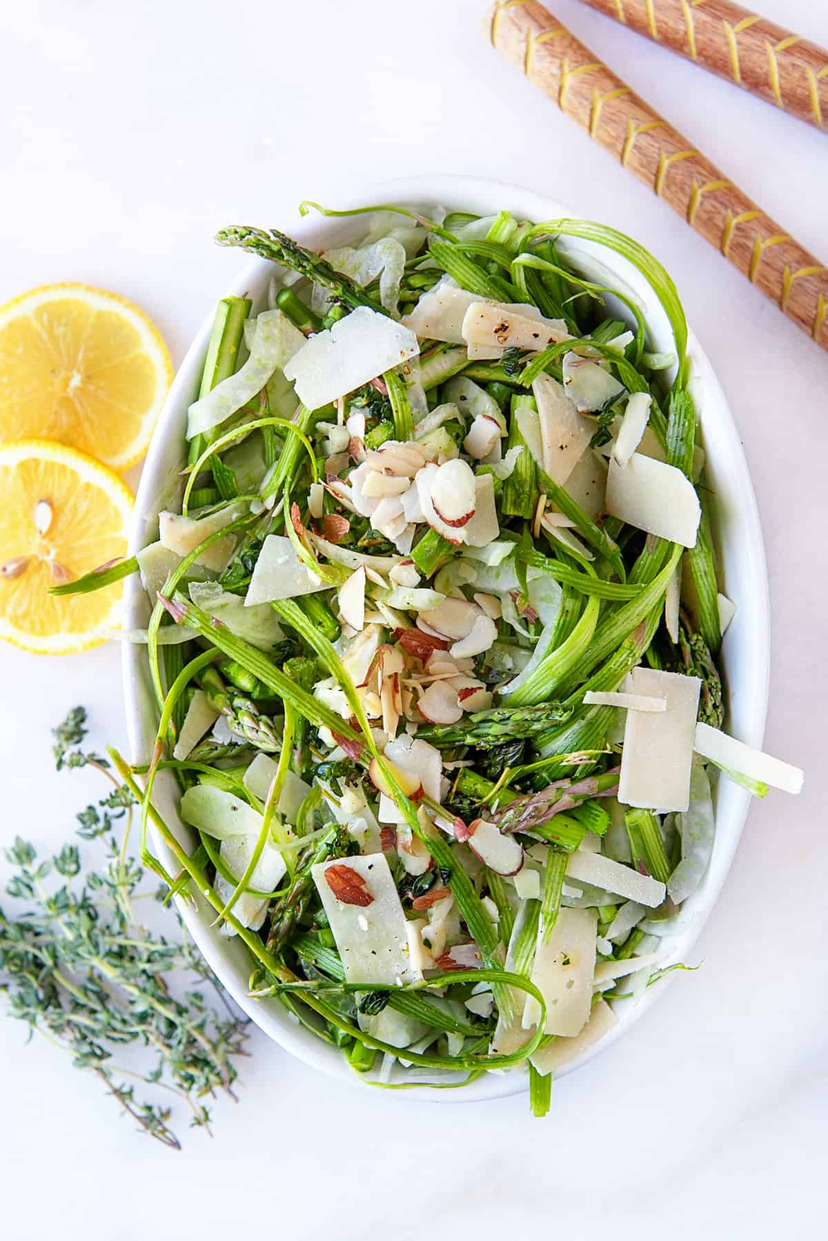 Overhead of Fennel Asparagus Salad with fresh lemon slices 