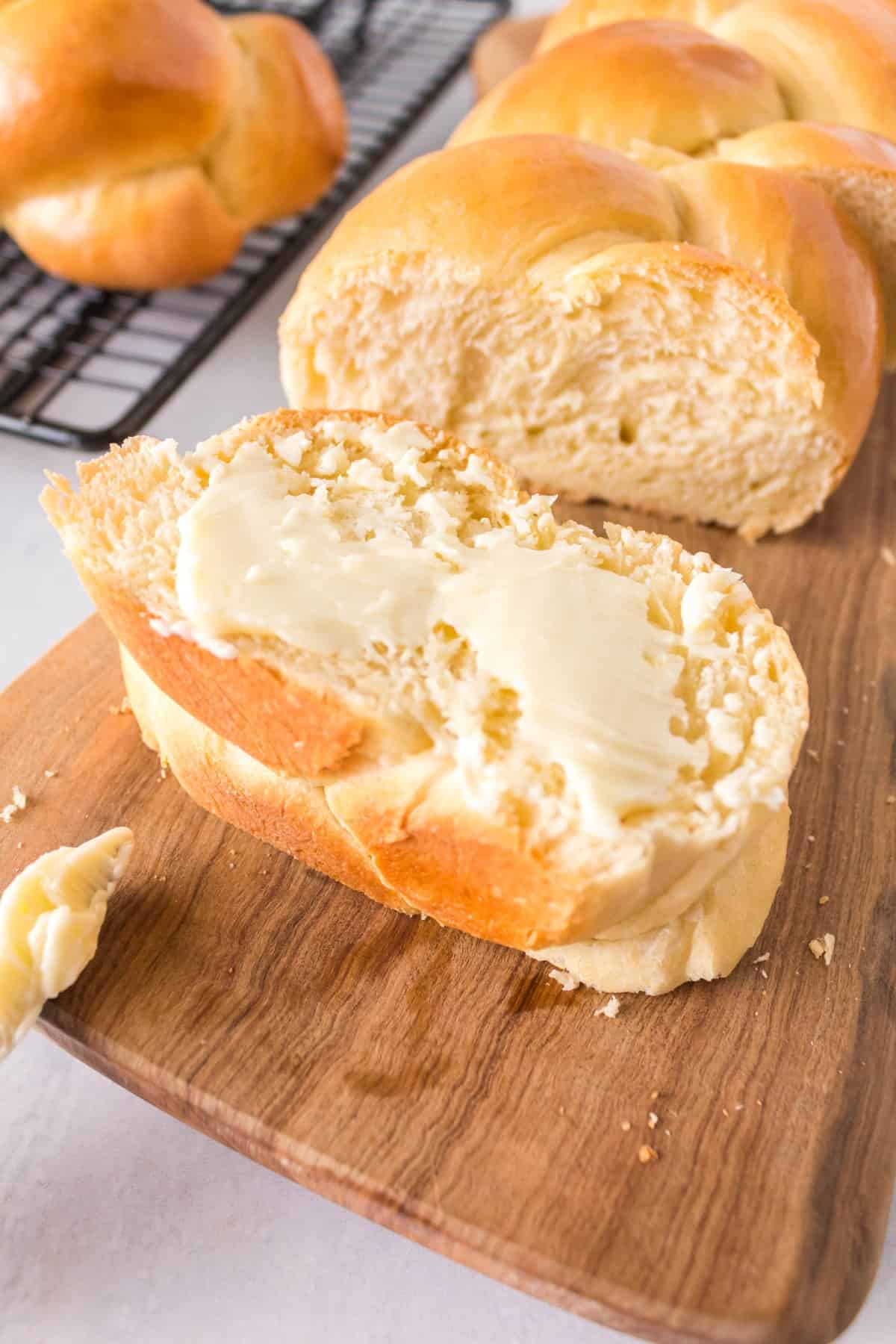 Sliced buttered white braided bread. 