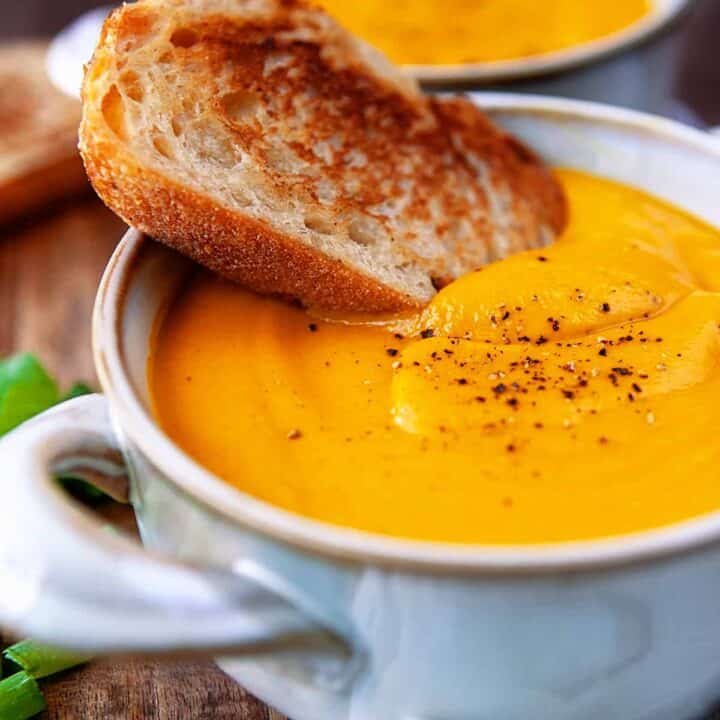 https://noshingwiththenolands.com/wp-content/uploads/2022/04/Carrot-Ginger-Soup-IMG_4583-720x720.jpg