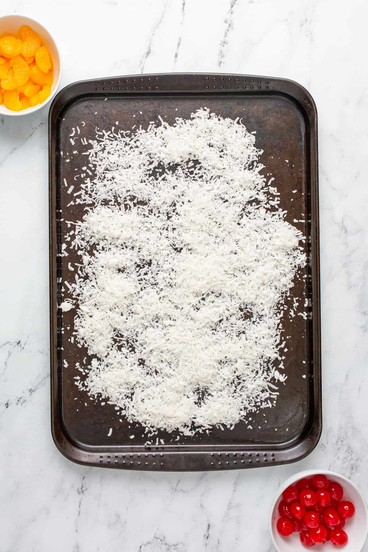 Pina Colada Fruit Dip - shredded coconut on a sheet pan prior to baking
