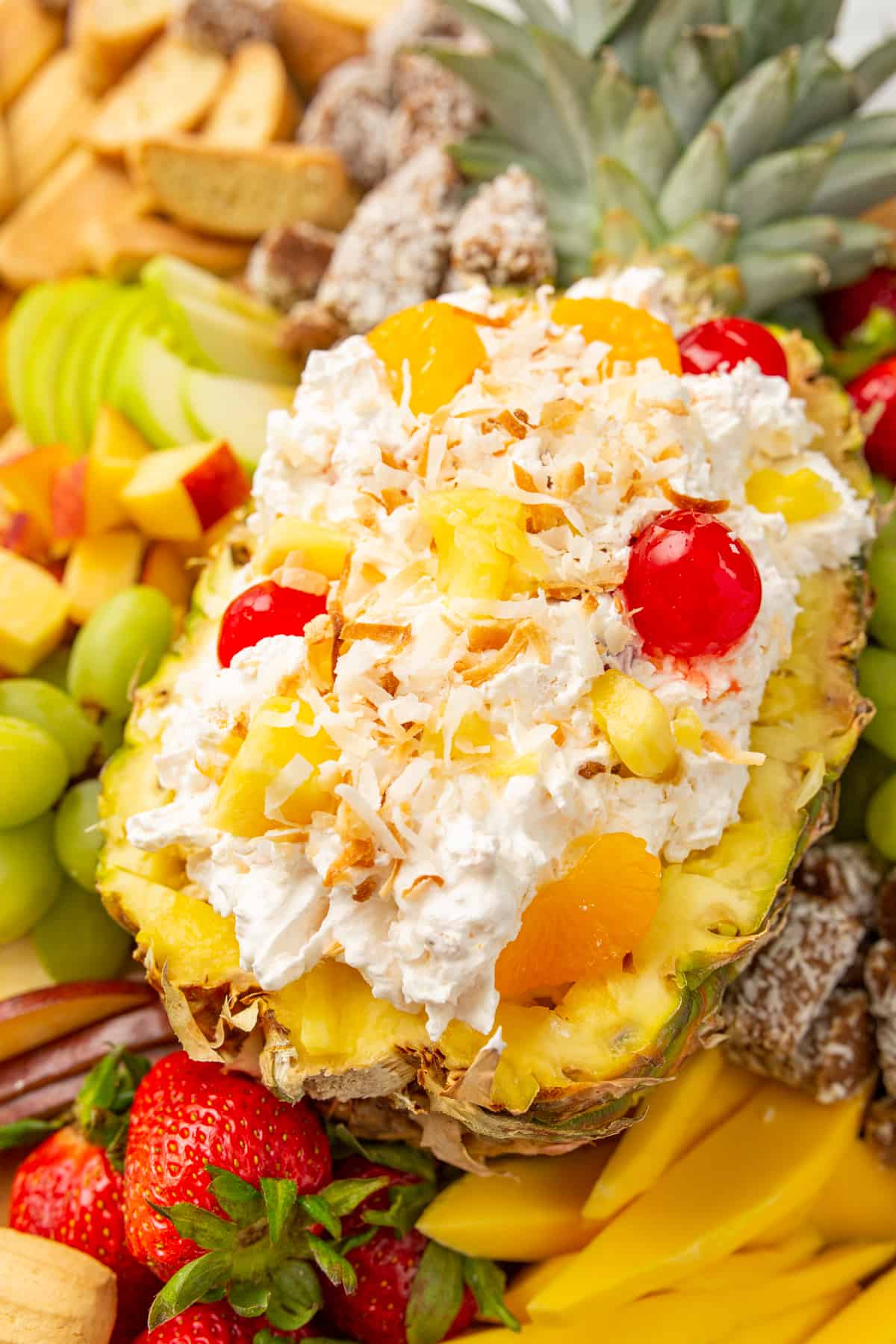 Pina Colada Easy Fruit Dip - fruit dip served on a fruit platter with toasted coconut on top