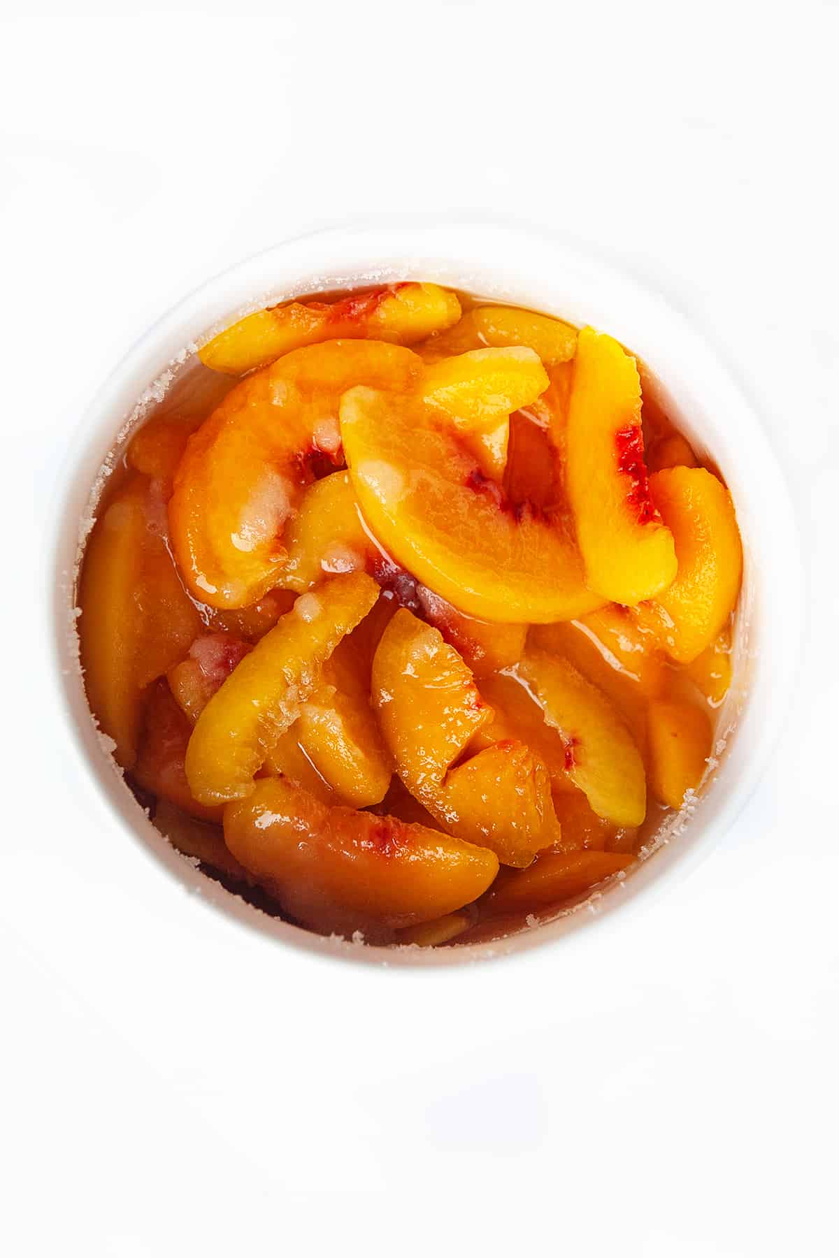 Bowl of peaches and sugar. 