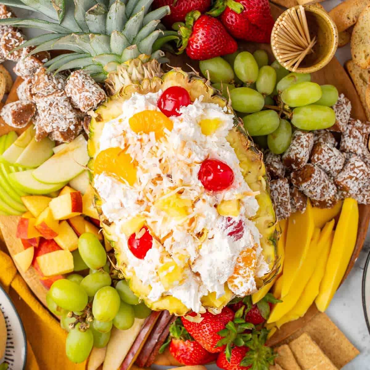 Overhead shot of Easy Pina Colada Fruit Dip in a pineapple. 