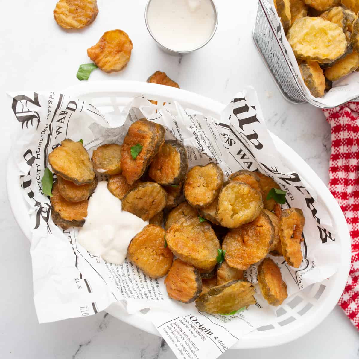 Overhead shot of Crispy Fried Pickles in a basket. 