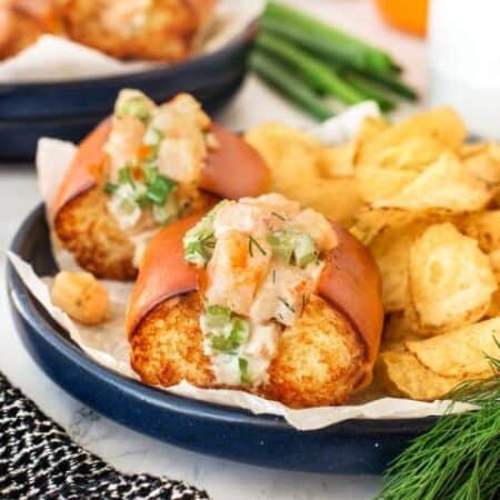 Shrimp Rolls on a plate with chips