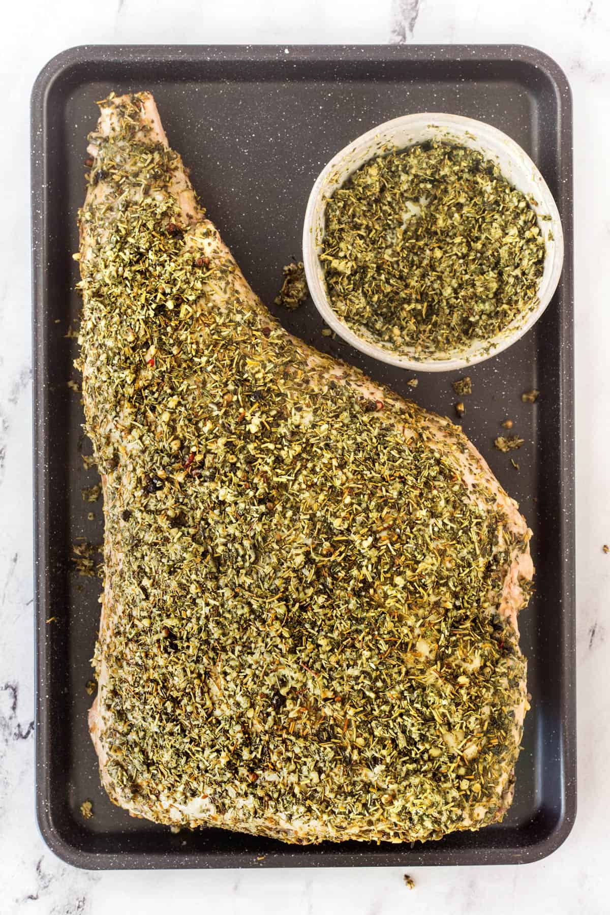 Overhead of herb crusted leg of lamb. 