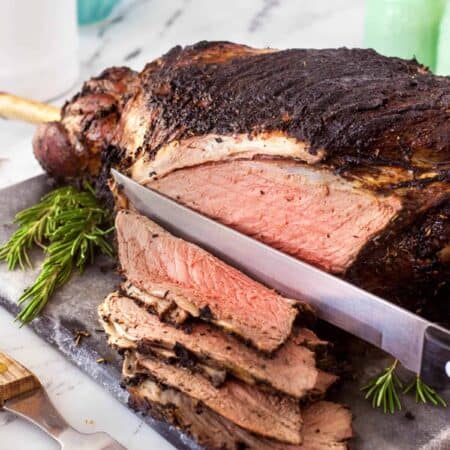 Slicing a gorgeous Herb Crusted Grilled Leg of Lamb.