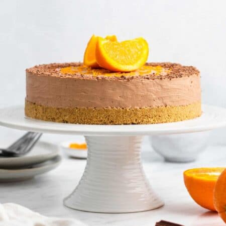 No-Bake Chocolate Cheesecake on a cake stand.