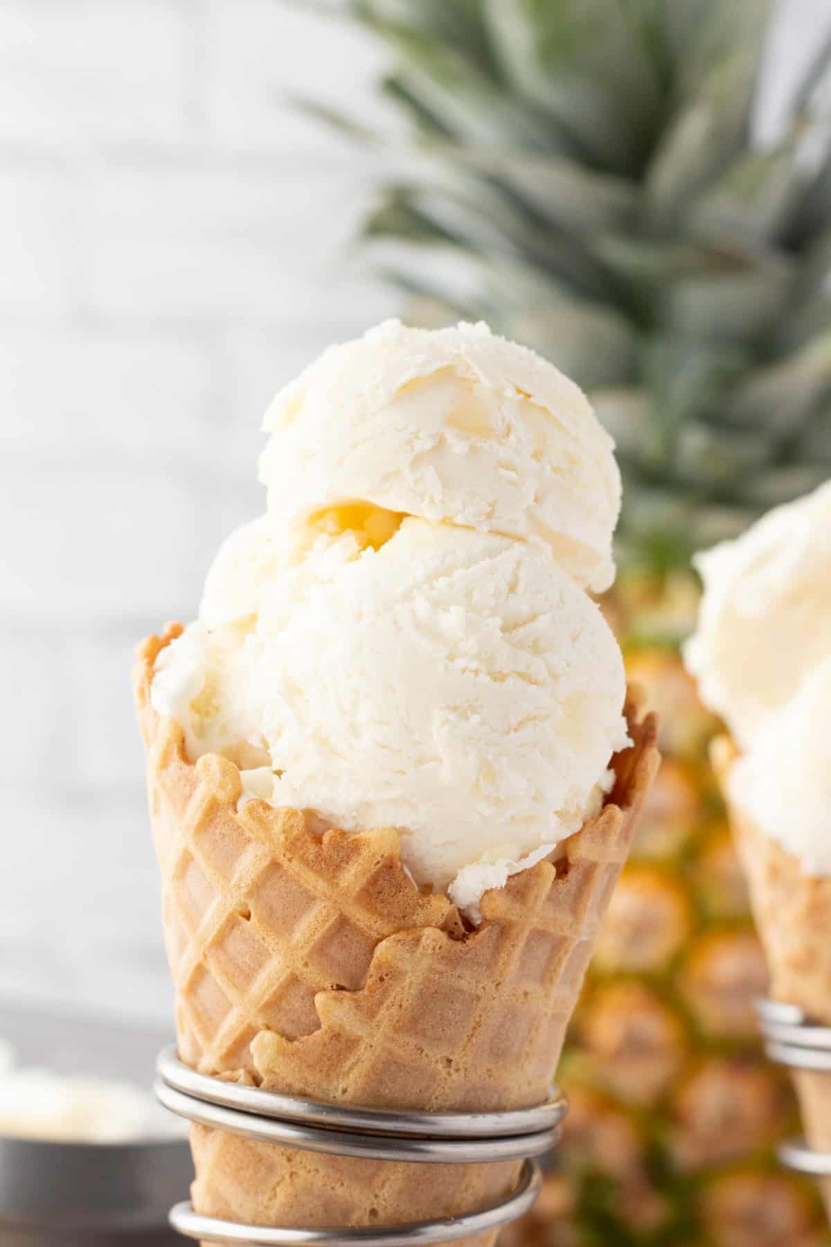 Pineapple Coconut Ice Cream in a cone. 