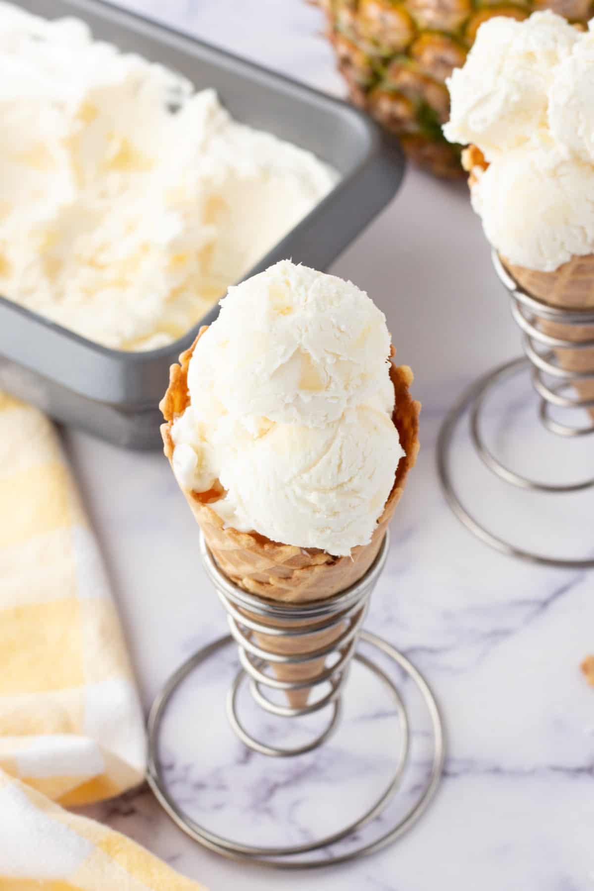 Overhead of ice cream in a cone in a stand. 