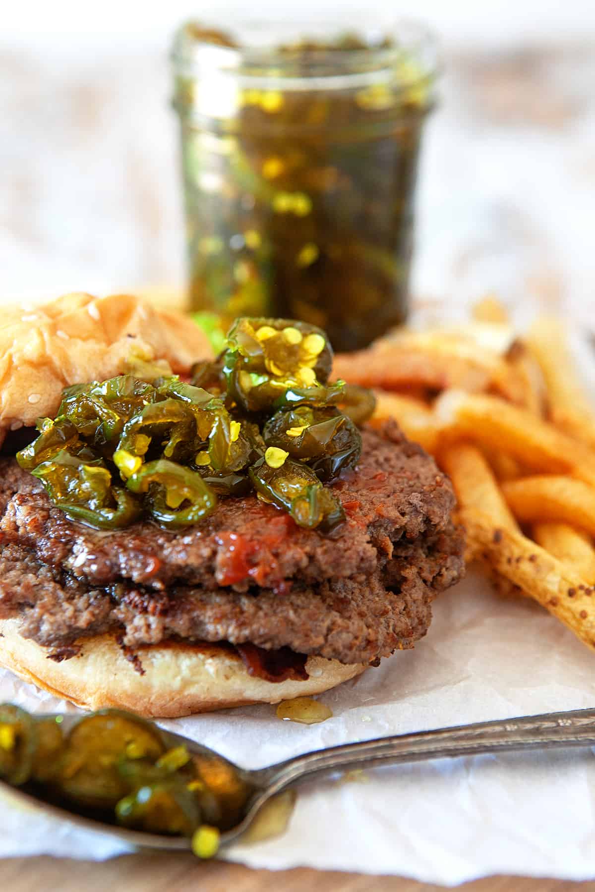 Showing candied jalapenos on top of burgers. 