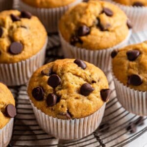 Banana Chocolate Chip Muffins on a cooling rack.