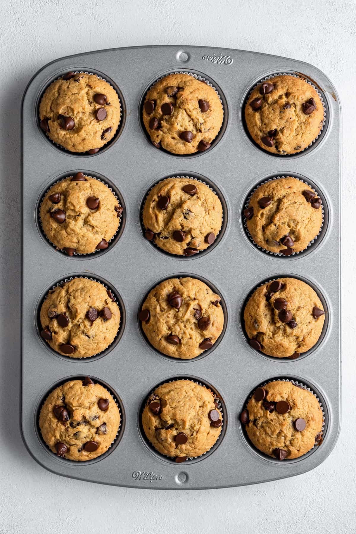 Overhead shot of muffins in a baking tin. 