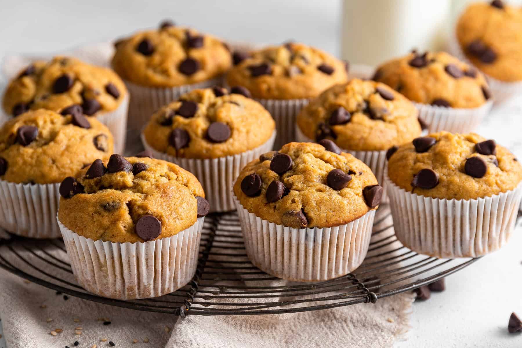 Horizontal photo of a muffins on a cooling rack. 