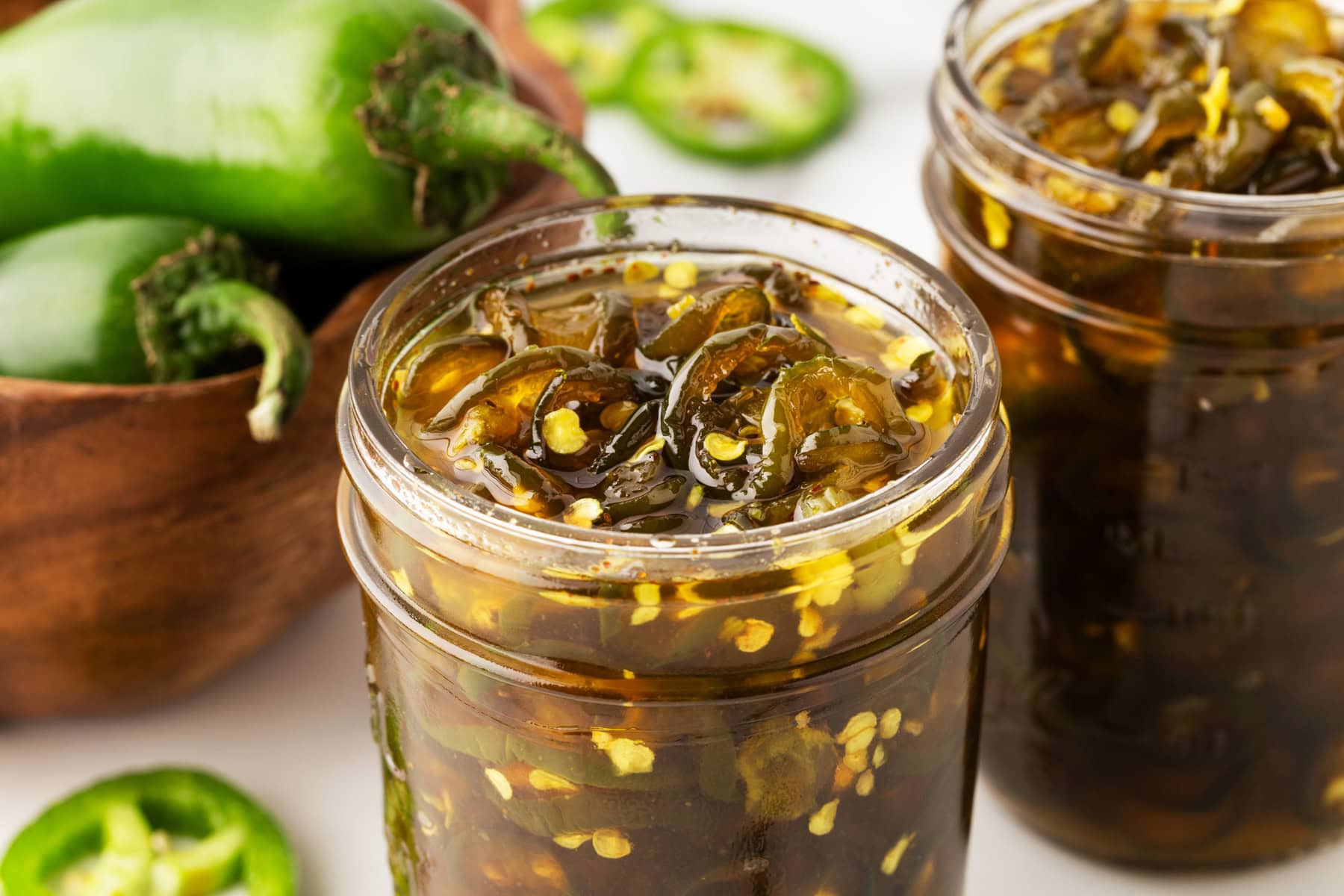 Opened jars of jalapenos. 