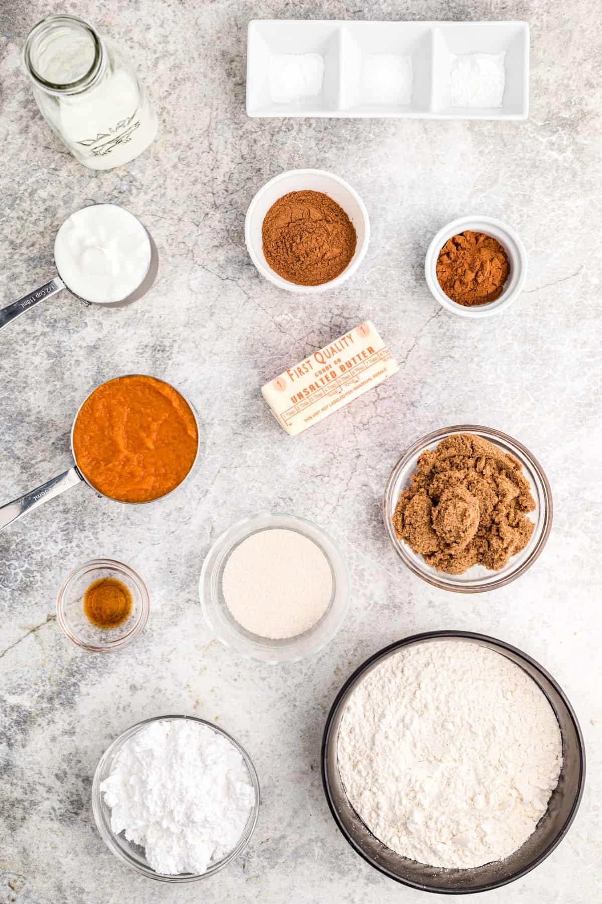 Ingredients for Pumpkin Coffee Cake on a marble background. 