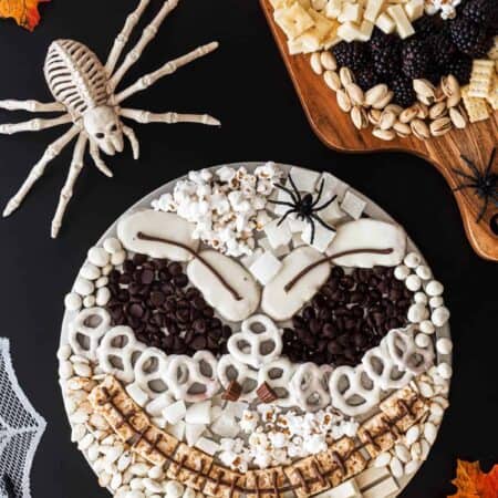 Two Halloween snack platters, one of Jack Skellington and one of a skull.