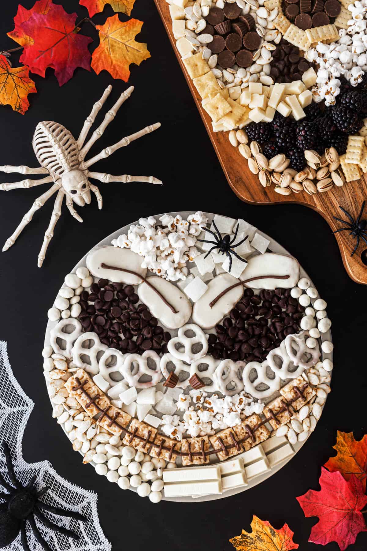 Two Halloween snack platters, one of Jack Skellington and one of a skull. 