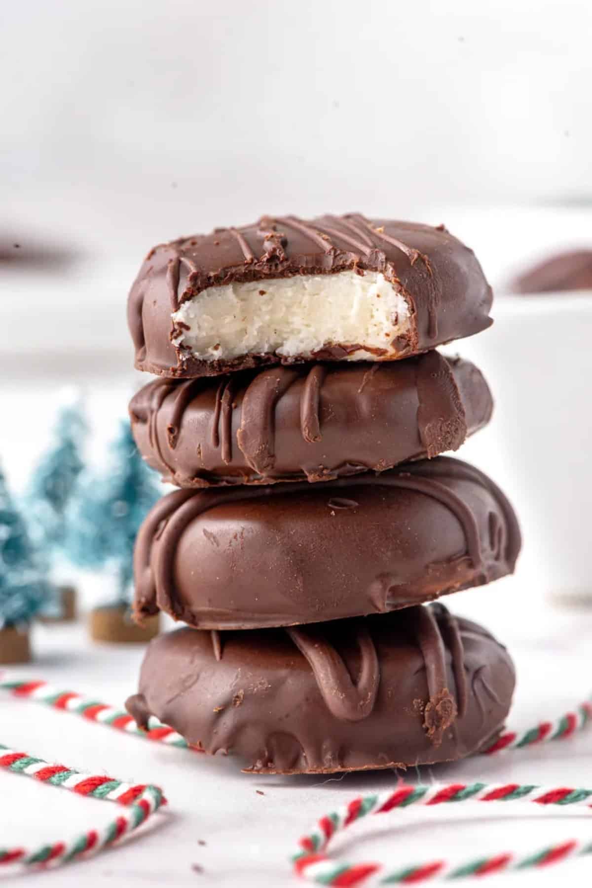 Peppermint Patty Candy stacked on top of one another with a bite taken out of the top patty.