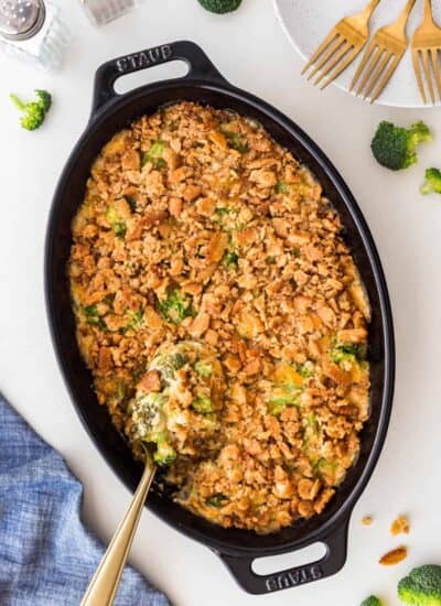 Overhead Traditional Cheesy Broccoli Casserole with a serving spoon in it.