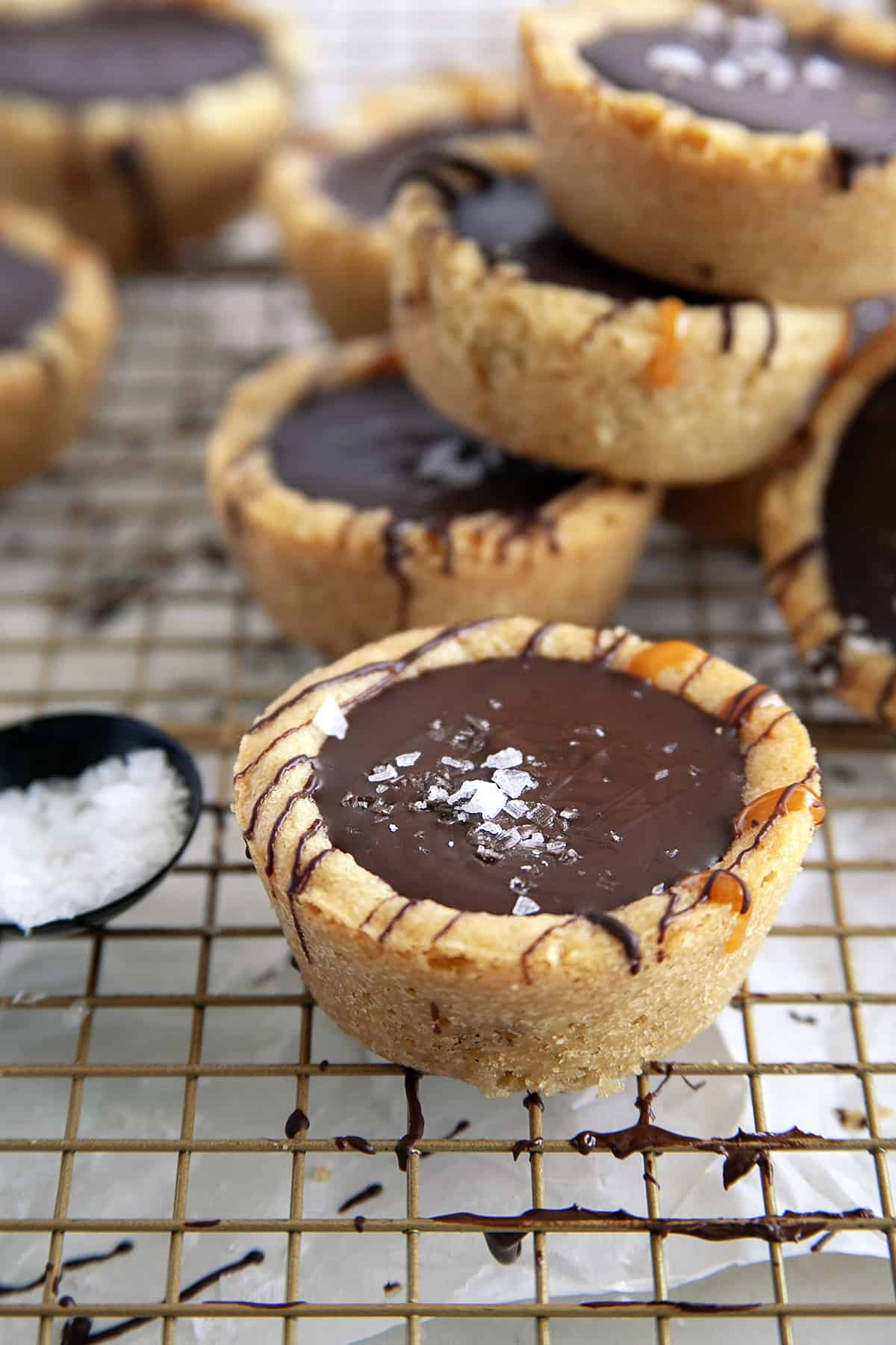 Showing flaky sea salt on top of a Chocolate Caramel Cookie Cup. 